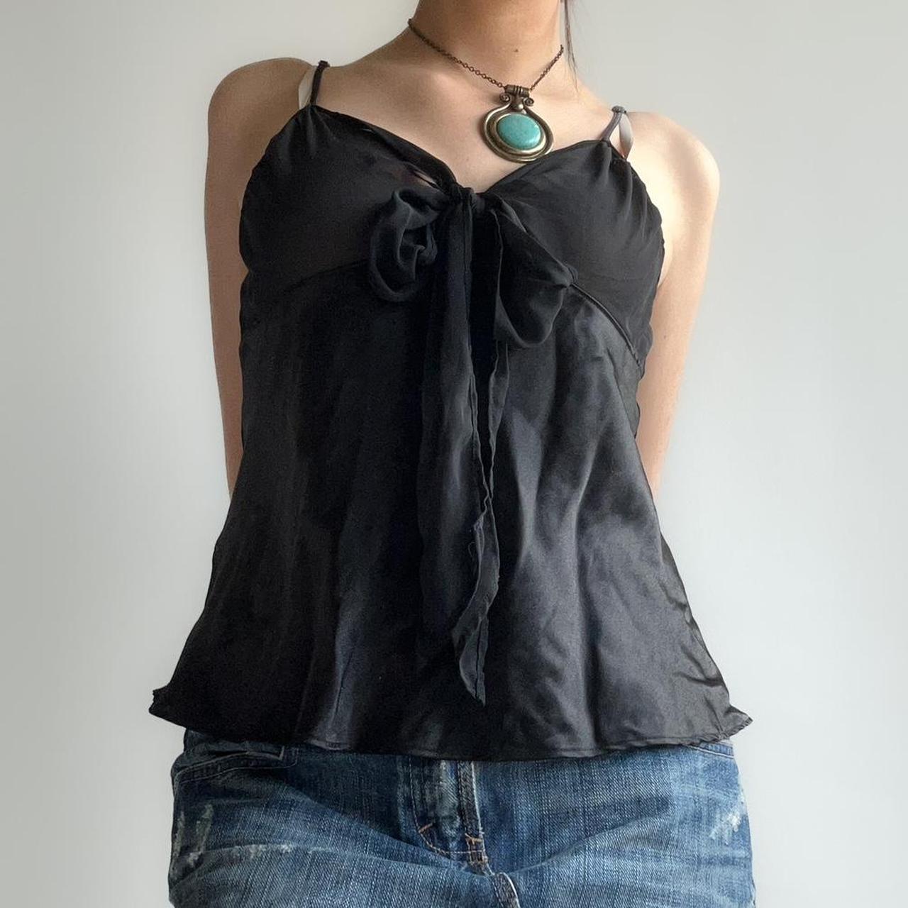 black sheer top with a tie up bow