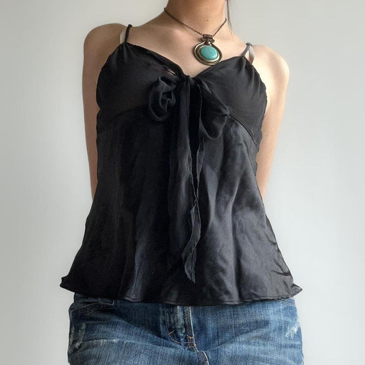 black sheer top with a tie up bow