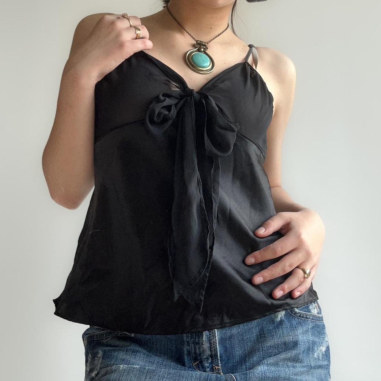 black sheer top with a tie up bow